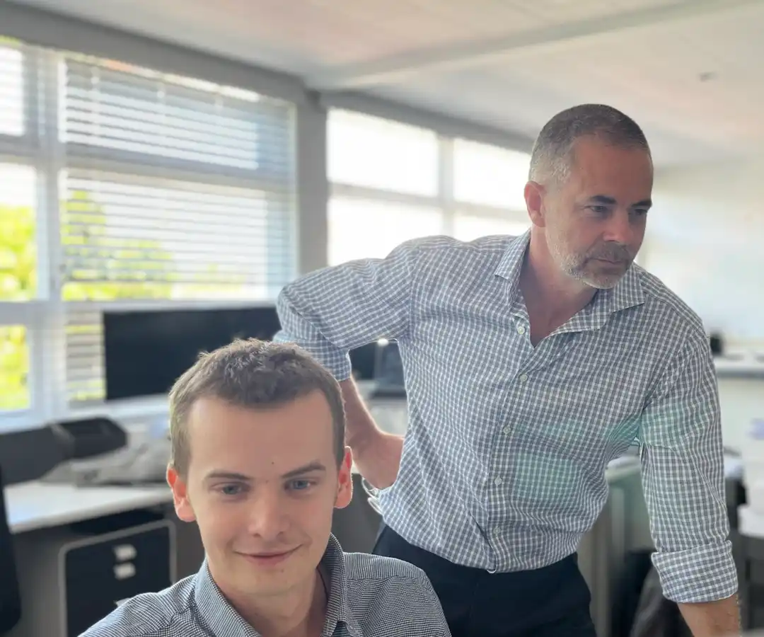 Caleb Lucas and Mark Lucas working through something on screen together